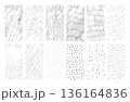 A set of abstract hand-drawn sketches in black ink, including scribbles, lines, dots, and marks, isolated on a white background. Vector illustration of simple doodle-style patterns, graphic elements 136164836
