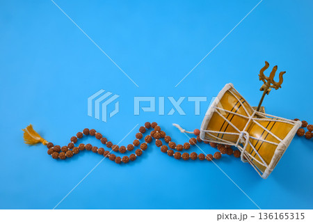 Maha Shivratri. Lord shiva symbols with damaru, trishula, rudraksha mala on blue 136165315