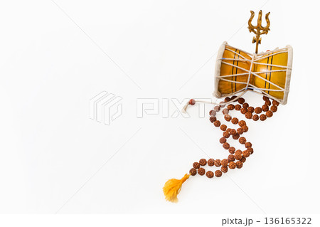Maha Shivratri. Lord shiva attributes, damru, trishul, and rudraksha mala Maha Shivratri. Lord shiva attributes, damru, trishul, and rudraksha mala 136165322