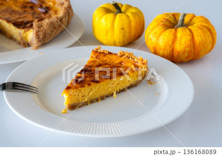 Slice of Homemade Pumpkin Cheesecake 136168089
