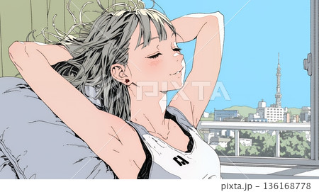 朝の目覚ましを止めて伸びをしている若い女性