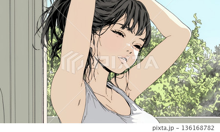 朝の目覚ましを止めて伸びをしている若い女性