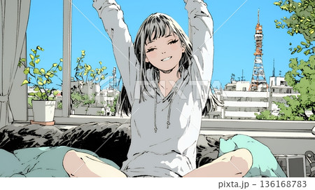 朝の目覚ましを止めて伸びをしている若い女性