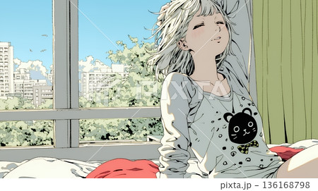 朝の目覚ましを止めて伸びをしている若い女性