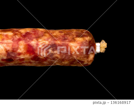 Sausage on a black background. Sausage on a black background. 136168917