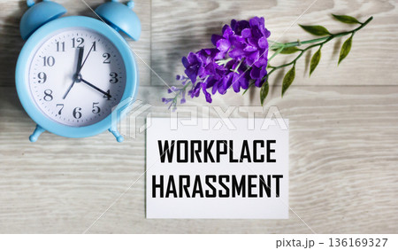 Harassment in the workplace, written on a notebook 136169327