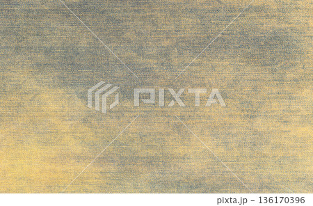 Washed blue and yellow denim fabric surface texture Washed blue and yellow denim fabric surface texture 136170396