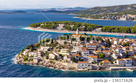 Aerial view of Primosten old town island in Croatia surrounded by Adriatic Sea turquoise water and summer sky 136171626