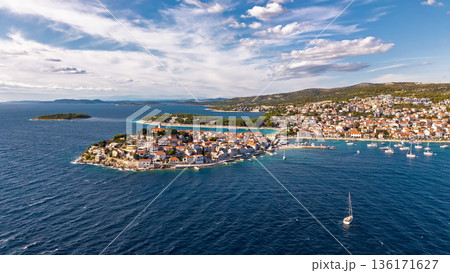 Drone panorama of Primosten Croatia showing historic peninsula marina yachts and turquoise Adriatic water 136171627