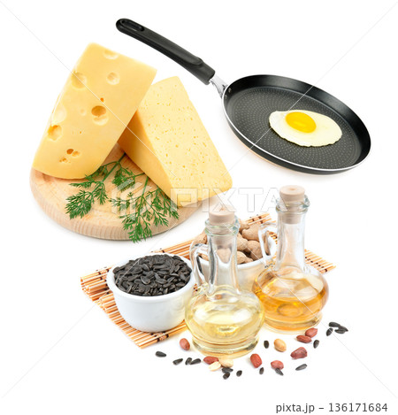 Kitchen flat lay with cooking oils, cheese, and seeds 136171684