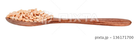 Peas in a brown wooden spoon isolated on white background Peas in a brown wooden spoon isolated on white background 136171700