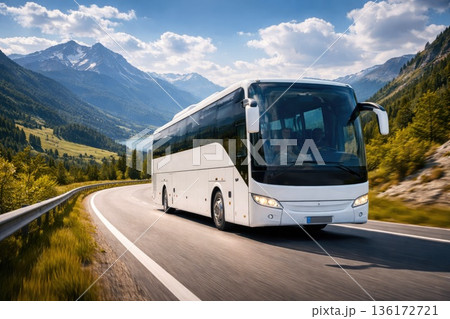 Modern Tourist Coach Bus Driving on Scenic Mountain Highway 136172721