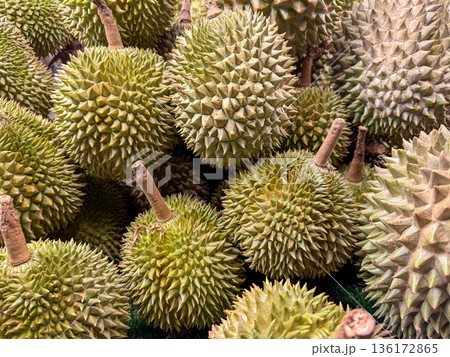 Fresh durian fruits at market stall 136172865