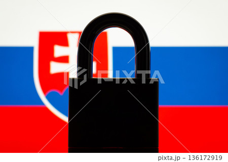 Conceptual photo of closed lock and flag of Slovakia. Sanctions, restrictions, closed border of Slovakia concept 136172919