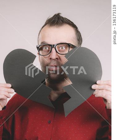 Sad man with broken heart. 136173119