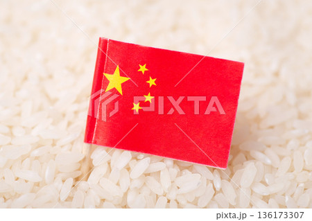 Flag of China on grain of rice. Concept of growing rice in China Flag of China on grain of rice. Concept of growing rice in China 136173307