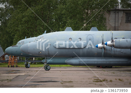 Old soviet civil propeller airliner. Russian turboprop old aircraft parking at the airport. Old soviet civil propeller airliner. Russian turboprop old aircraft parking at the airport. 136173950