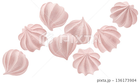 Falling pink meringue cookies isolated on white background with airy sweet texture, full depth of field 136173984