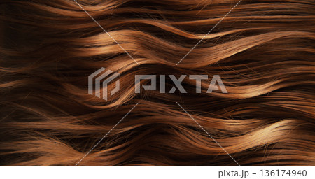 Close-up abstract texture of flowing brown hair forming elegant natural waves and curves. Organic motion, soft light and rich tones create a cinematic beauty background or luxury visual element. 136174940