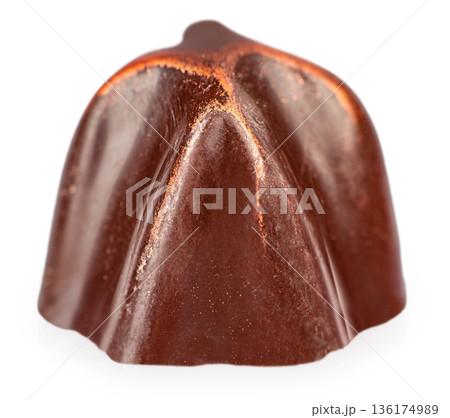 Dark chocolate praline candy isolated on white background 136174989