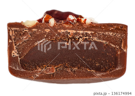 Chocolate candy cross section with rich dark filling isolated on white 136174994