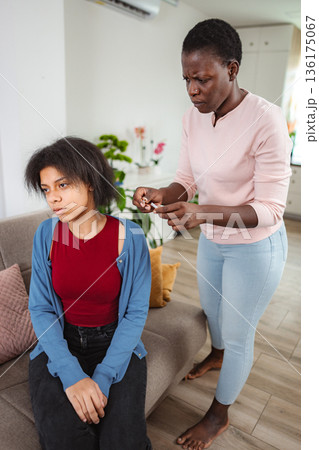 Mother Scolding Teenage Daughter at Home Mother Scolding Teenage Daughter at Home 136175067