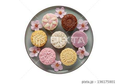Various mooncakes with floral sakura decorations, perfect for lunar festival themes, gift boxes, and food photography Various mooncakes with floral sakura decorations, perfect for lunar festival themes, gift boxes, and food photography 136175801