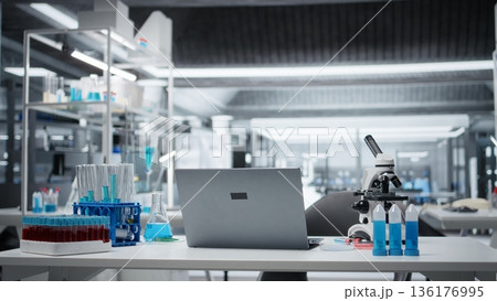 Sterile empty medical laboratory workspace featuring test tube racks on workbench. Clean research facility interior free of contamination with nobody in, ready for scientific work Sterile empty medical laboratory workspace featuring test tube racks on workbench. Clean research facility interior free of contamination with nobody in, ready for scientific work 136176995
