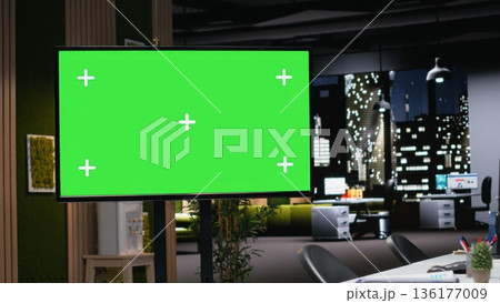 Isolated screen display in office used to automate app development tasks with deep learning. Chroma key monitor in empty startup workplace leverages AI to accelerate feature implementation, close up 136177009