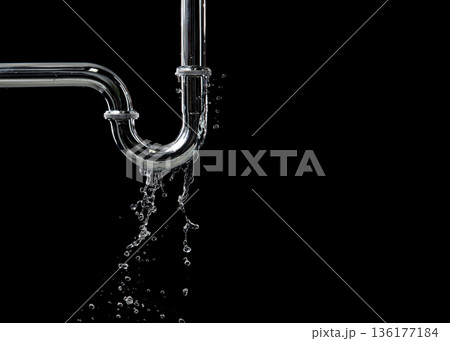 Drain leak water from pipe plumbing in bathroom as water clogged drop. Black background isolated. Leaking water from chromium stainless steel pipe under sink Drain leak water from pipe plumbing in bathroom as water clogged drop. Black background isolated. Leaking water from chromium stainless steel pipe under sink 136177184