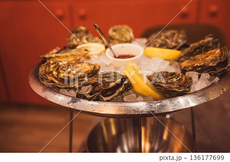 Fresh Raw Oysters with Citron, Baguette, Butter, and Cider Fresh Raw Oysters with Citron, Baguette, Butter, and Cider 136177699