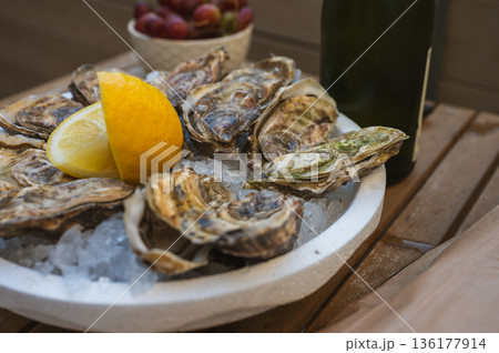 Fresh Raw Oysters with Citron, Baguette, Butter, and Cider Fresh Raw Oysters with Citron, Baguette, Butter, and Cider 136177914