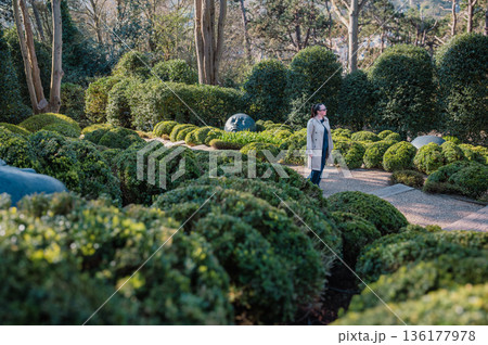 Woman in Jardins d'Etretat 136177978