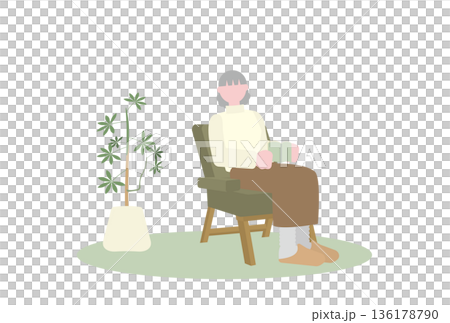 一人がけソファで読書をするシニア女性 136178790