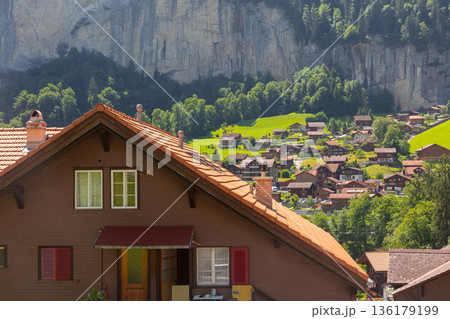 Lauterbrunnen valley with alpine village and cliffs in summer 136179199