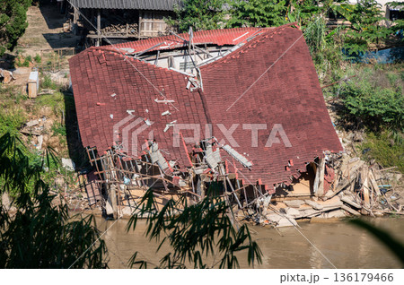 Local houses in Karen village elephant camp in Mae Yao district destroyed after Typhoon Yagi has swept Chiang Rai province of Thailand. 136179466