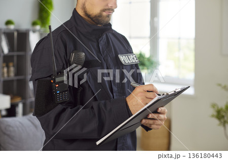Police Officer Filling Report At Crime Scene Police Officer Filling Report At Crime Scene 136180443