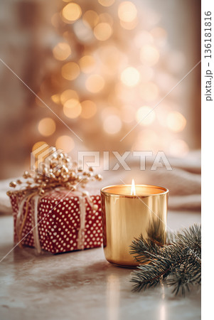 Gold candle holiday decor christmas gift warm light festive mood bokeh background evergreen branch cozy atmosphere glowing 136181816