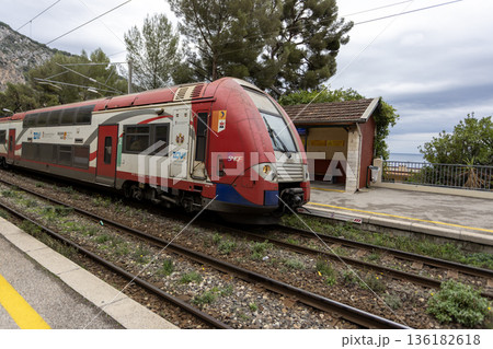 a train of Transport express regional (TER) by SNCF arrival to Eve town train station from Monaco a train of Transport express regional (TER) by SNCF arrival to Eve town train station from Monaco 136182618