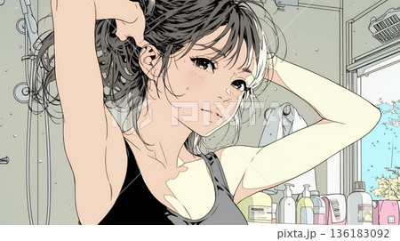 朝支度：洗面所で髪をまとめている若い女性