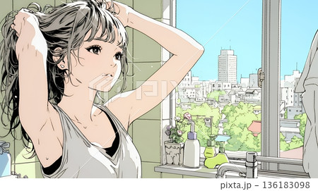 朝支度：洗面所で髪をまとめている若い女性 136183098