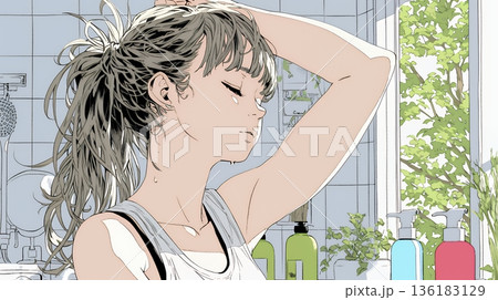 朝支度：洗面所で髪をまとめている若い女性