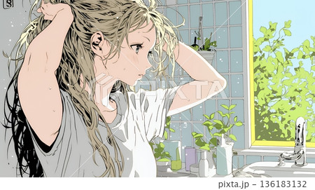 朝支度：洗面所で髪をまとめている若い女性 136183132