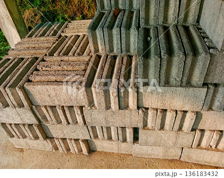 neatly arranged pile of bricks image 136183432
