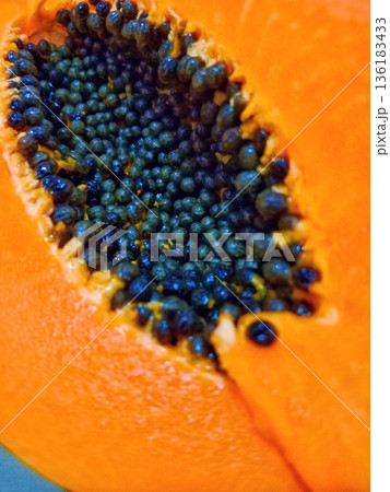 close up of split papaya fruit 136183433