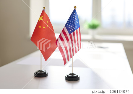 China and United States desk flags symbolizing diplomatic meeting on table China and United States desk flags symbolizing diplomatic meeting on table 136184074