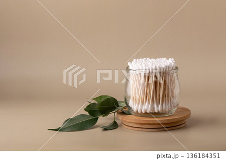 Bamboo cotton swabs in glass jar with eucalyptus branch Bamboo cotton swabs in glass jar with eucalyptus branch 136184351