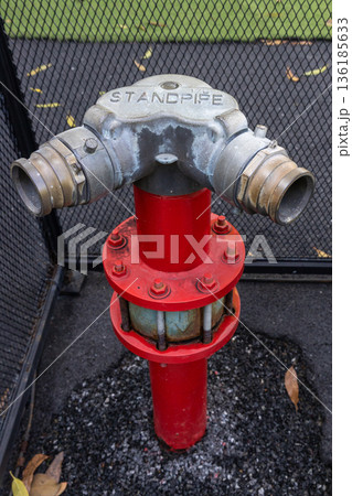 Hydrant with water hoses and fire extinguish equipment. Hydrant with water hoses and fire extinguish equipment. 136185633