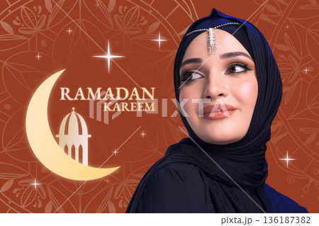 Celebration of Ramadan with a woman in a hijab and traditional wear in a festive setting Celebration of Ramadan with a woman in a hijab and traditional wear in a festive setting 136187382