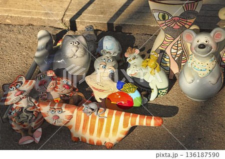 Chisinau, Moldova - October 15,2022: City Day. Souvenir figurines of cats and other animals. Chisinau, Moldova - October 15,2022 Chisinau, Moldova - October 15,2022: City Day. Souvenir figurines of cats and other animals. Chisinau, Moldova - October 15,2022 136187590